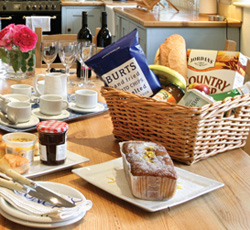 A complimentary welcome hamper is provided on your arrival which includes essentials such as tea, coffee, sugar and milk along with a few extra goodies.  Please note that the size and contents of the hamper may vary from property to property and there may be regional and seasonal variances.  Sadly we are unable to vary the contents according to preference, or cater for individual dietary requirements.